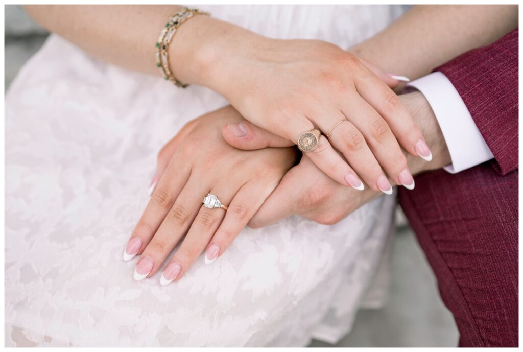 couples hands in charleston south carolina at the mills house hotel engagement session