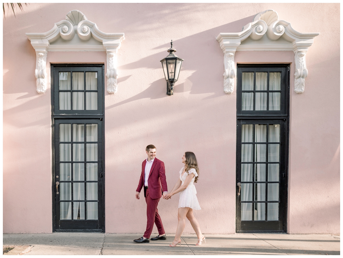 Couple walking in front of the mills house hotel in charleston engagement session