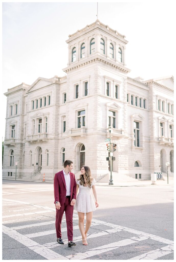 couple walking across the street at 4 corners in charleston south carolina