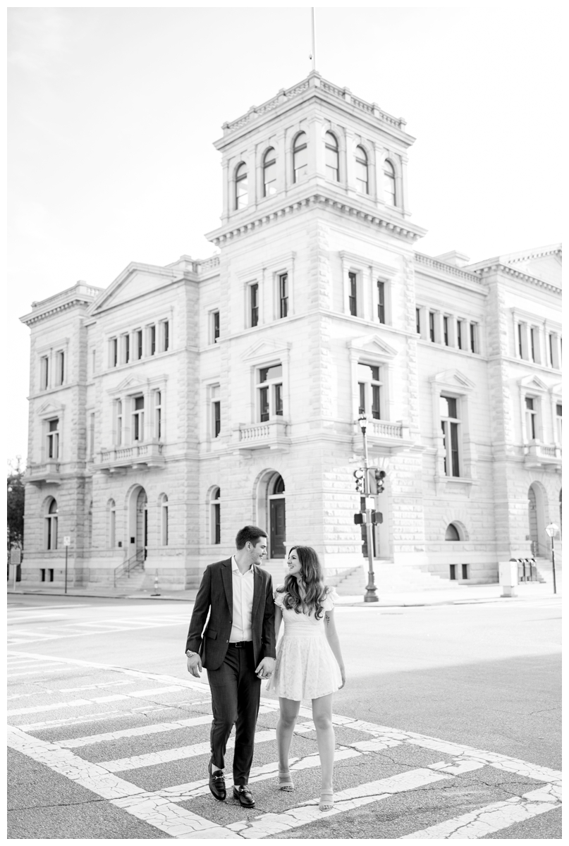 couple walking across the street at 4 corners in charleston south carolina