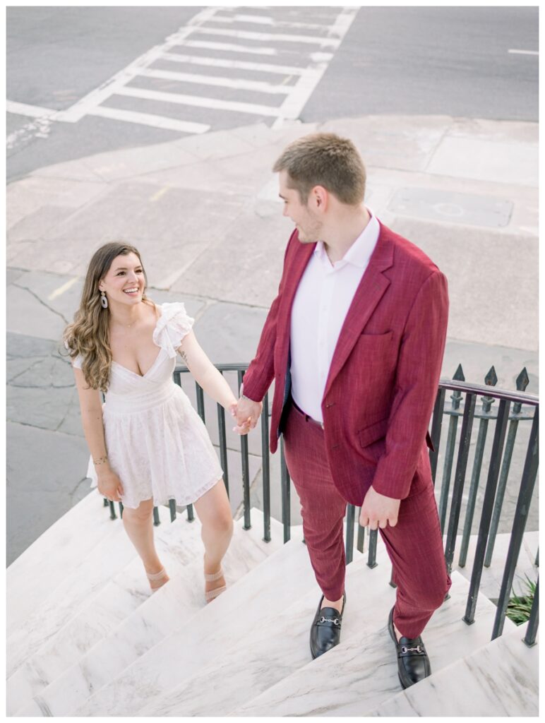 couple walking up steps at 4 corners in charleston south carolina