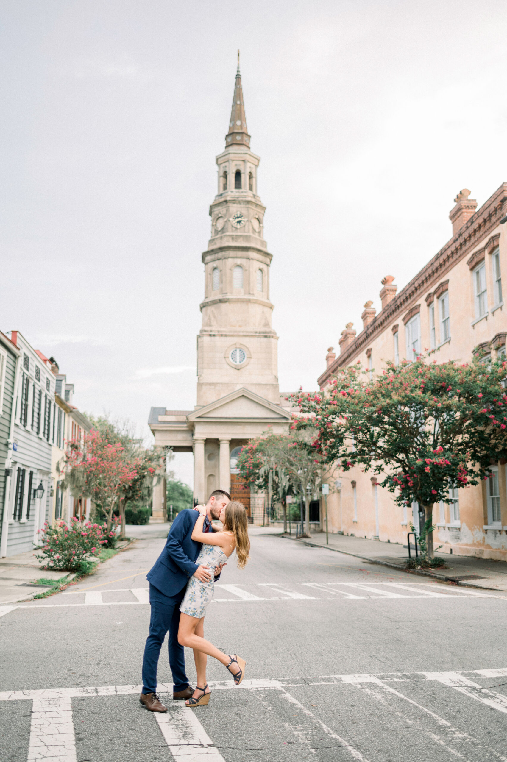 couple kissing in the middle of the street for an august engagement session
