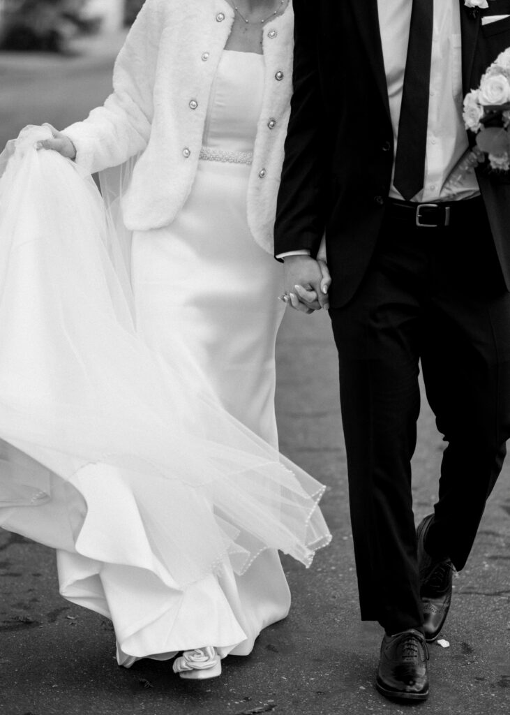 bride and groom walking during their modern day fairy tale wedding in savannah