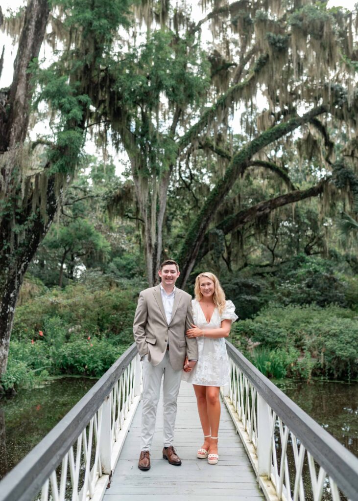 Bride-to-be in white dress and groom-to-be in tan suit at Magnolia Plantation